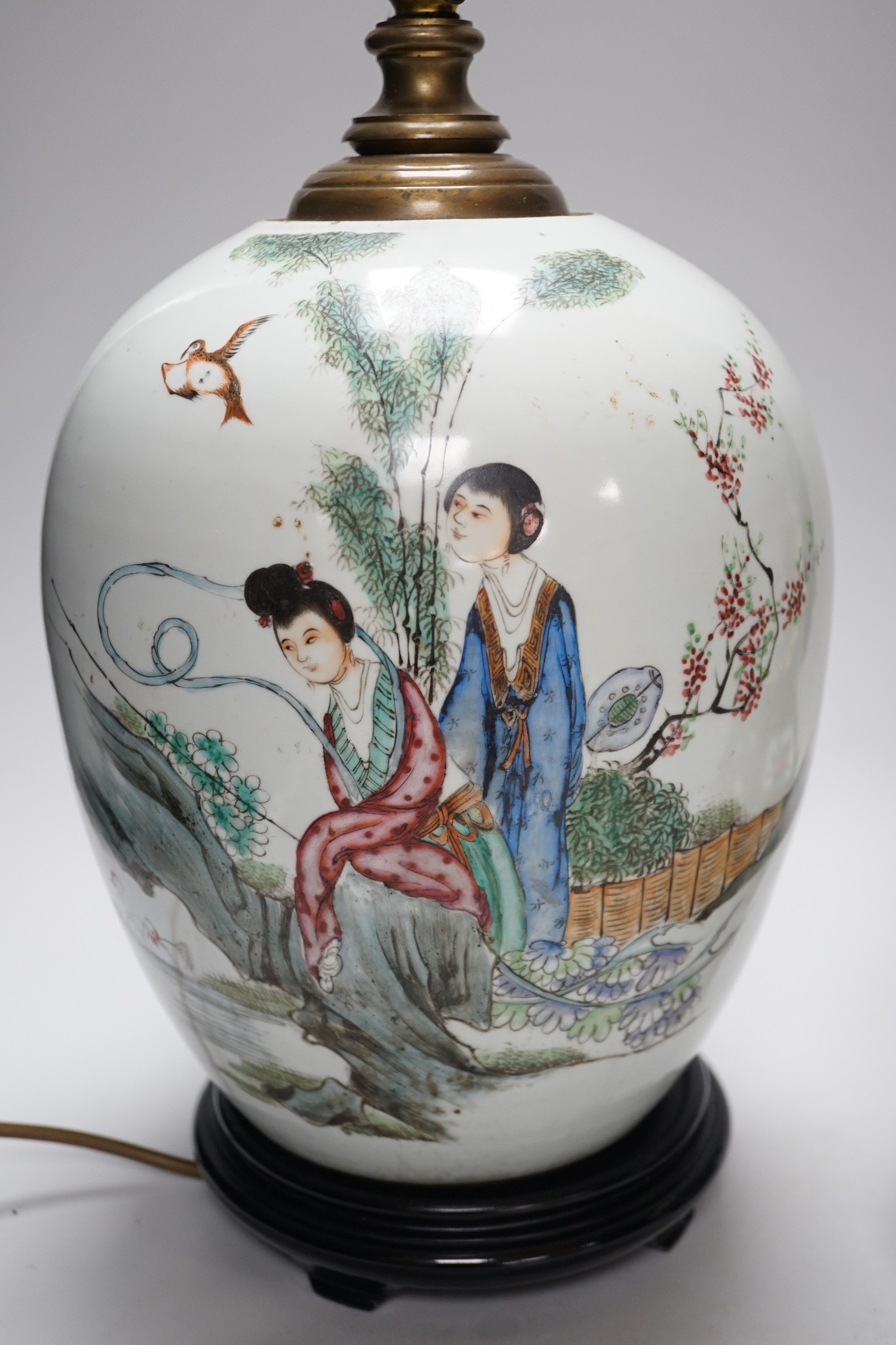 A Chinese famille rose vase converted to a lamp, 26cm, and a larger Chinese vase/lamp base, on stand, 41cm high